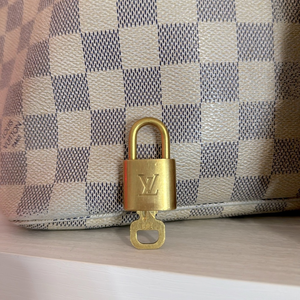 Louis Vuitton lock and key gold 303